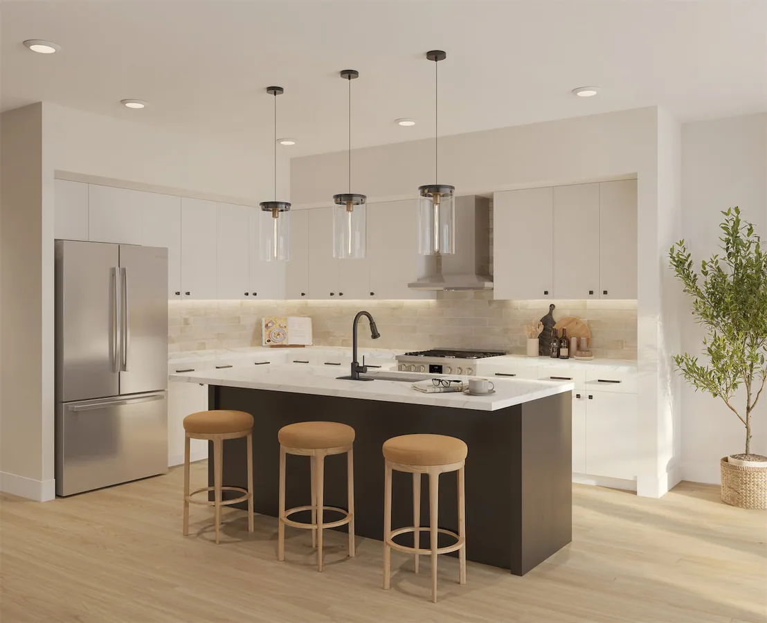 Homesite 5 kitchen with quartz counters, custom cabinetry, and three island seats.
